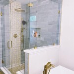 glass shower with brass hardware