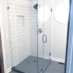frameless glass shower in corner